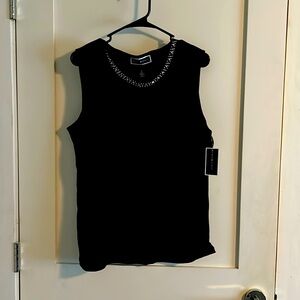 Black tank top with decorative neckline.  New with tags
